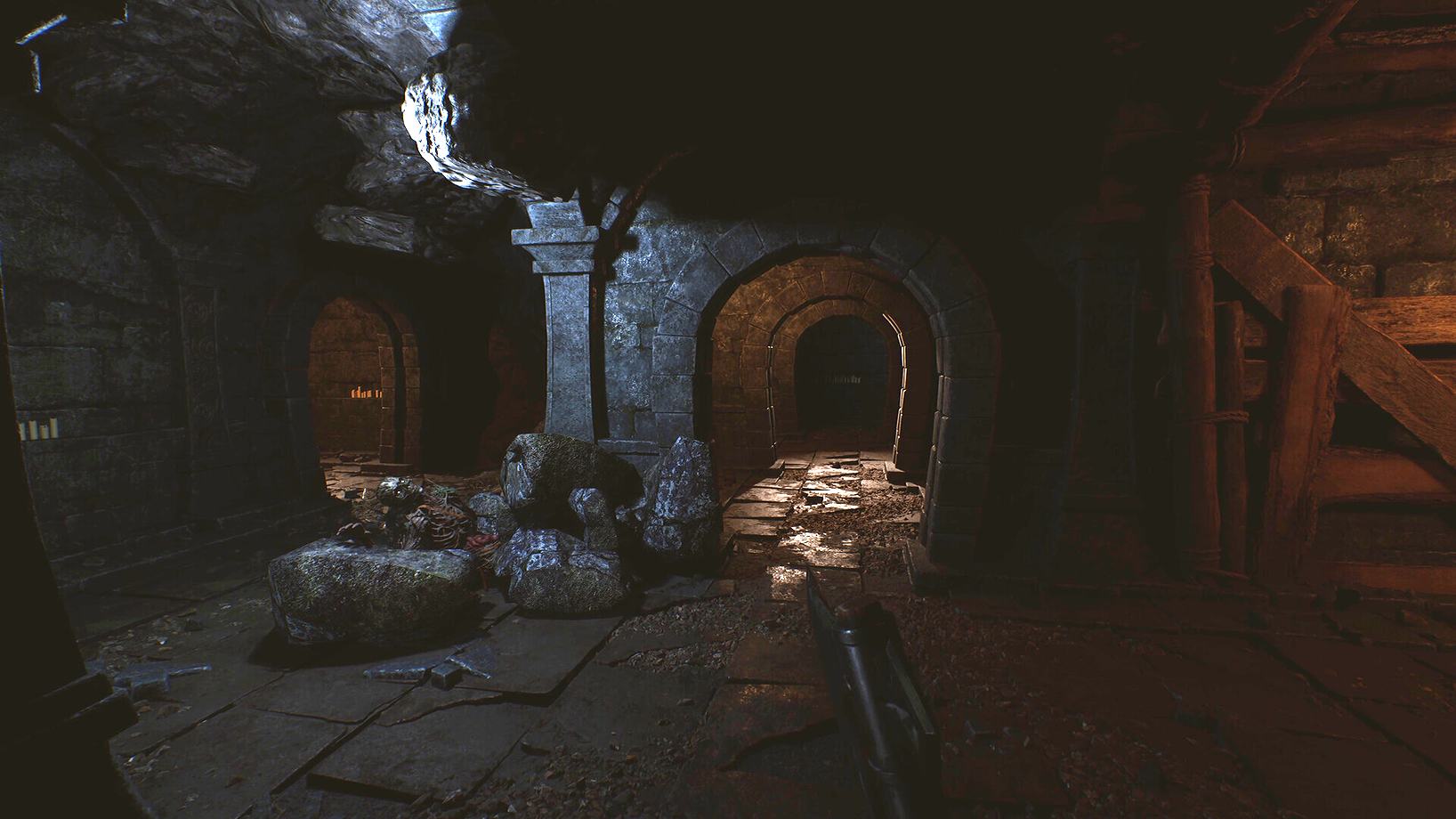 A dim stone passage inside a dungeon in Among the Trolls
